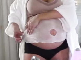 Sexy Pregnant Blonde disrobes to her bra&amp;panties