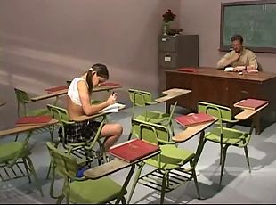 Teen girl fucks with her teacher right in the classroom.